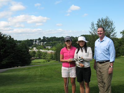 Lisle with two golfers at the Newton Commonwealth Golf Course